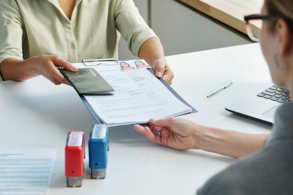 Giving passports and papers to immigration signing service specialist